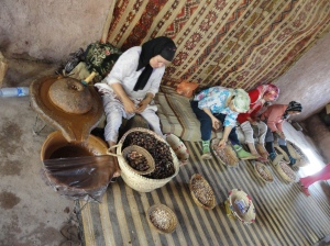 Berber woman making argan oil things